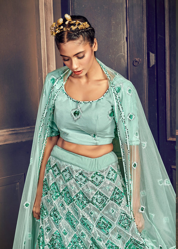 APPEALING TURQUOISE BLUE NET EMBROIDERED GHAGRA CHOLI WITH DUPATTA